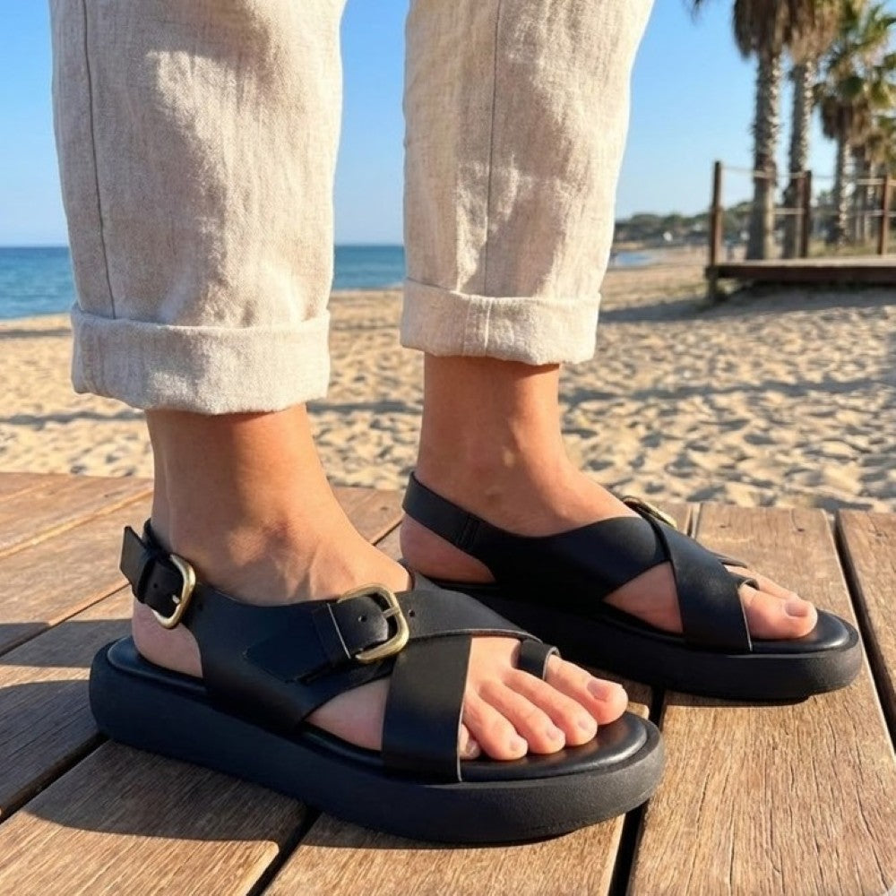 Wonders Black Leather Sandals worn at a beach