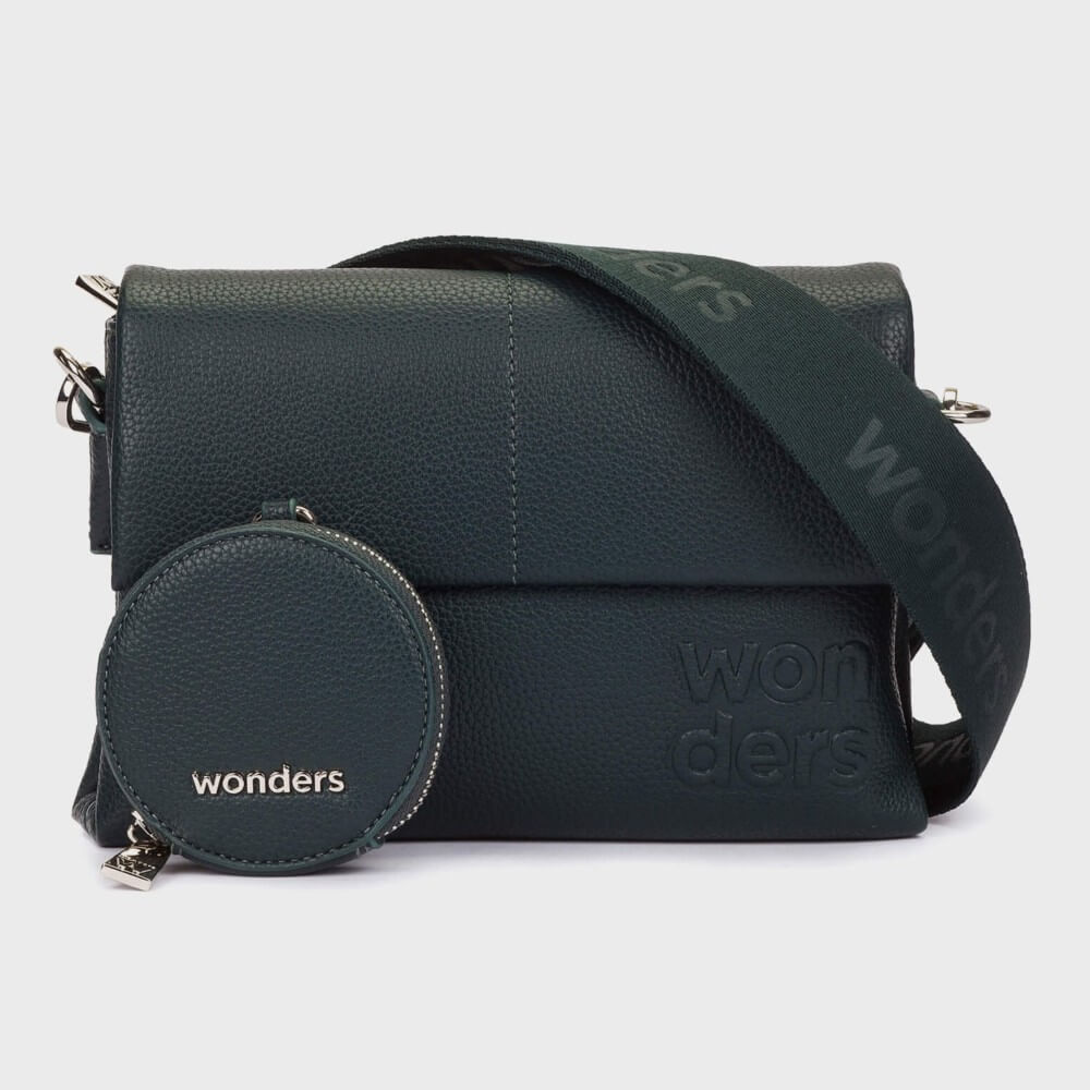 A Wonders  dark green pebbled Faux leather crossbody bag with a matching round zippered pouch and a wide branded shoulder strap, shown on a light grey background.