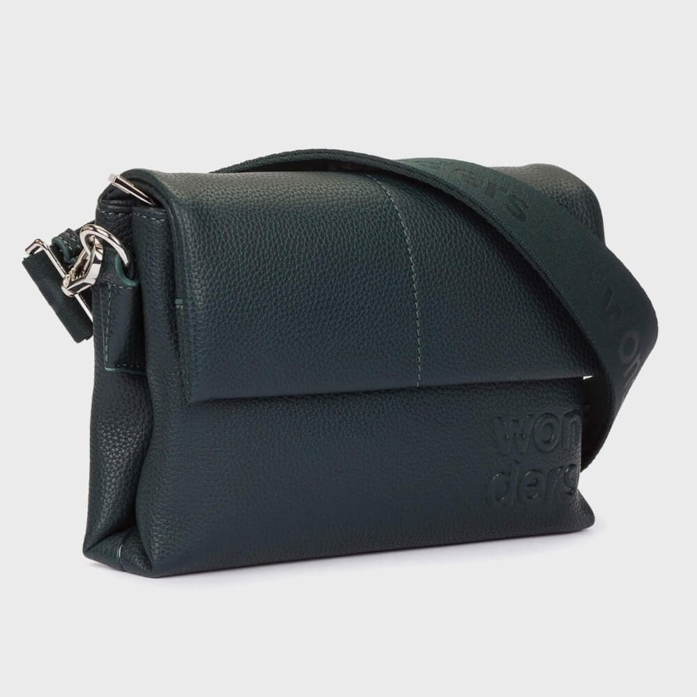 A Wonders  dark green pebbled Faux leather crossbody bag with a matching round zippered pouch and a wide branded shoulder strap, shown on a light grey background.