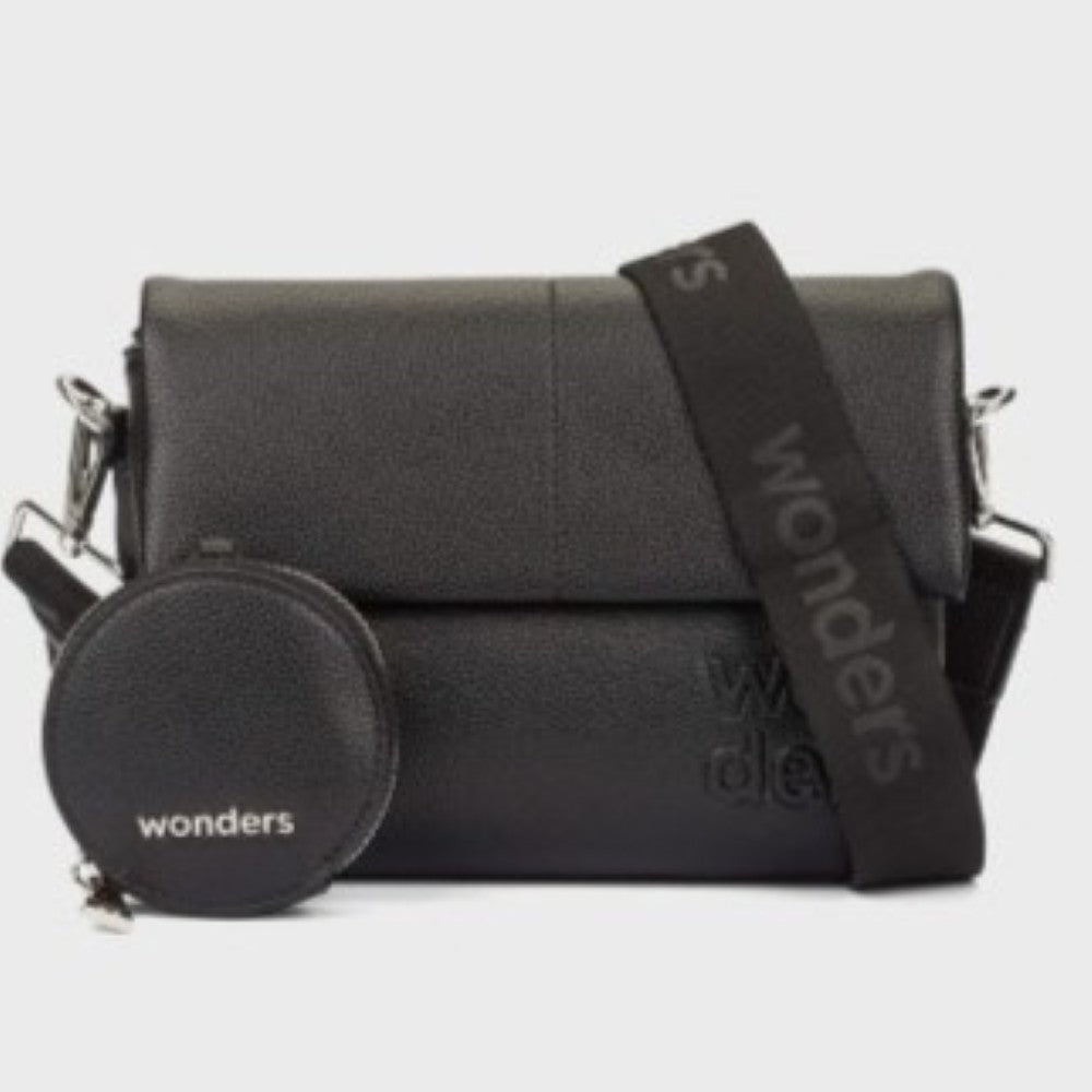 A Wonders black textured Faux leather crossbody bag with a matching round zippered pouch and a wide black shoulder strap, both featuring the debossed brand name 'wonders' in white, set against a plain light grey background.