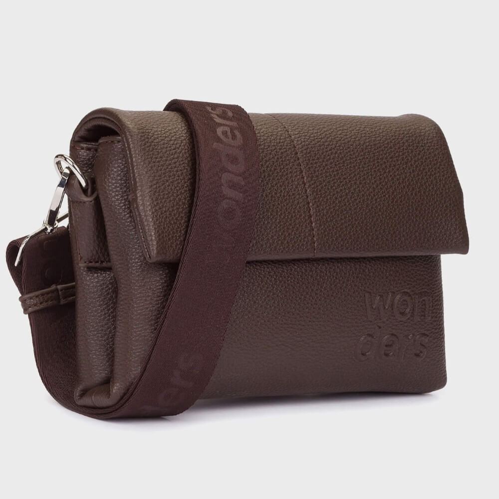 A Wonders dark brown pebbled Faux leather crossbody bag with a matching fabric shoulder strap featuring the debossed brand name 'wonders'. The bag has a front flap and is shown on a light grey background.