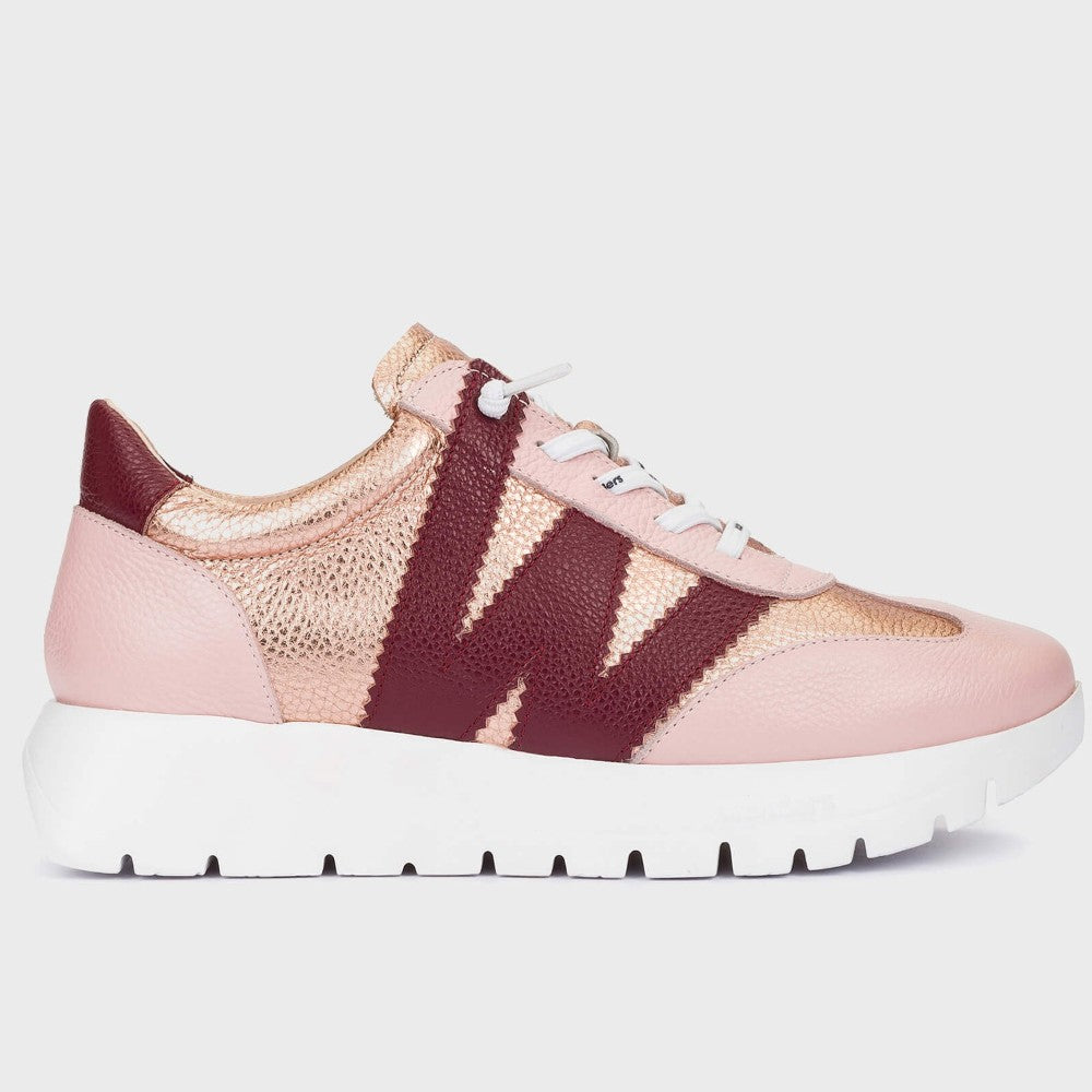 Wonders Pink and gold sneaker with a white sole on a light grey background
