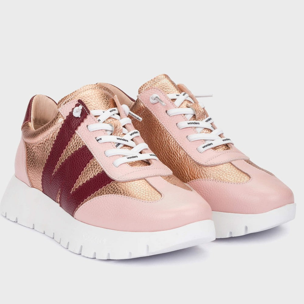 Wonders Pink and gold sneakers with white laces on a light grey background