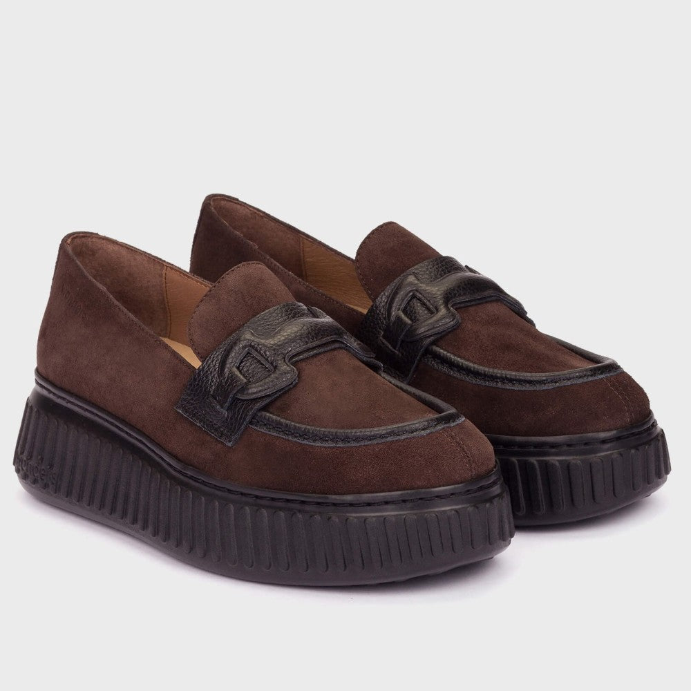 A pair of Wonders dark brown suede platform loafers with black leather strap details and thick black ribbed platform soles, shown on a light grey background.
