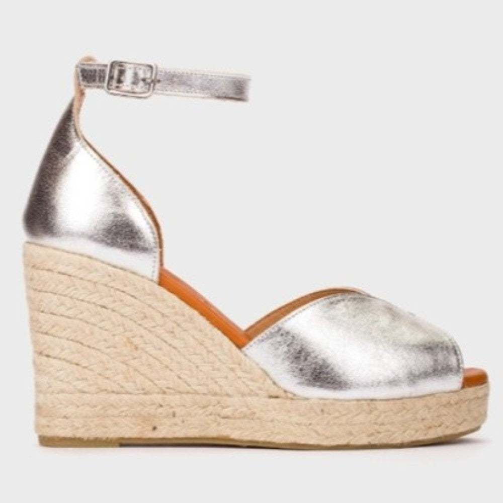 Wonders Silver wedge espadrille with a textured sole on a light gray background