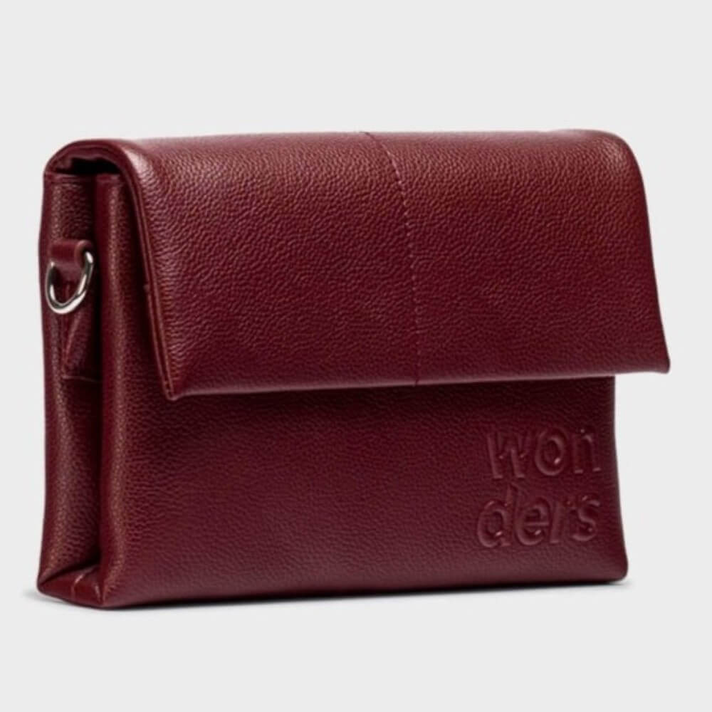 burgundy crossbody with 'wonders' branding on a light grey background