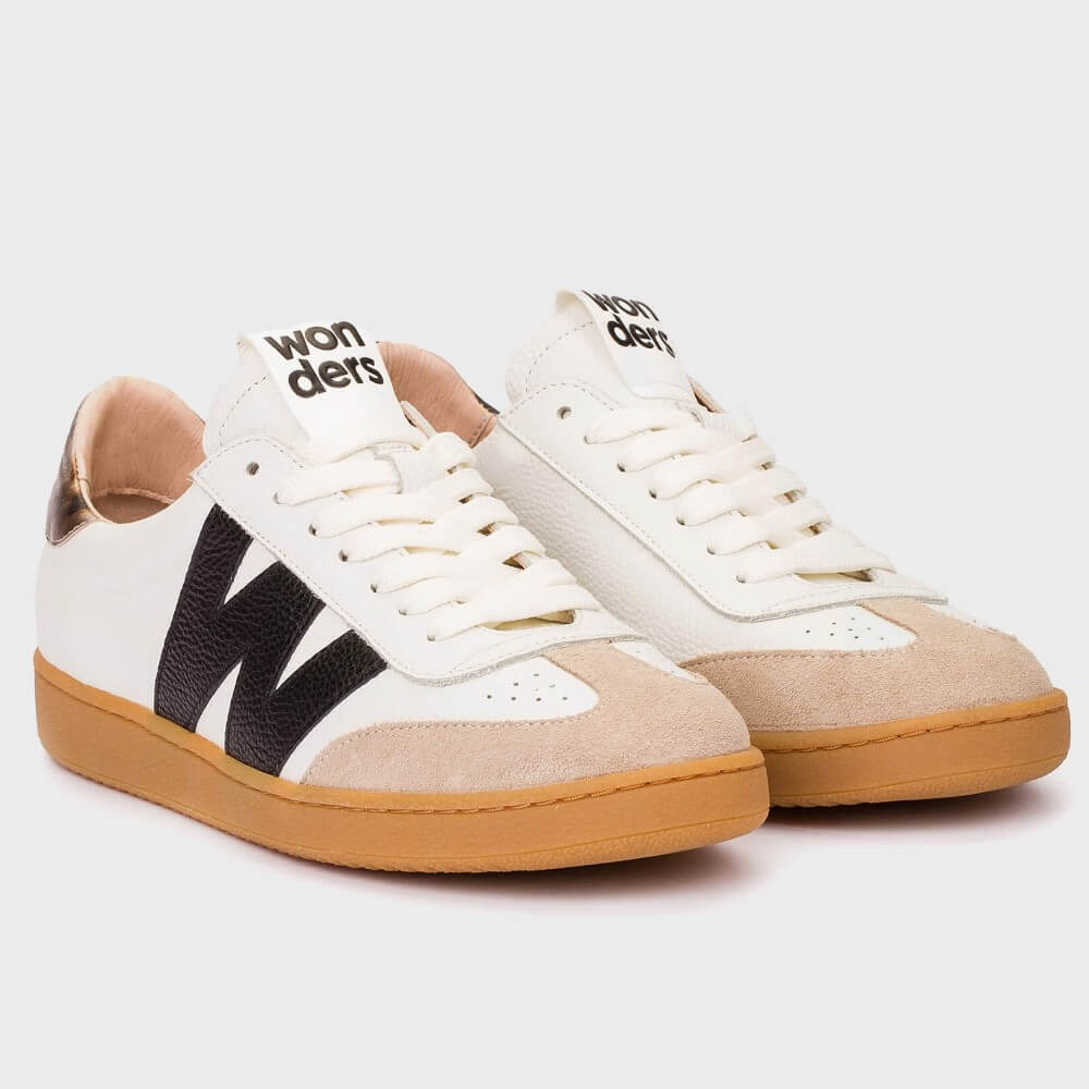 Pair of white sneakers with brown soles and black 'W' logo on a white background