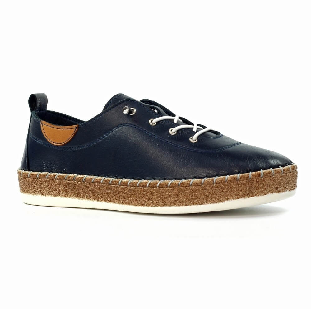 Navy blue leather shoe with brown sole on a white background