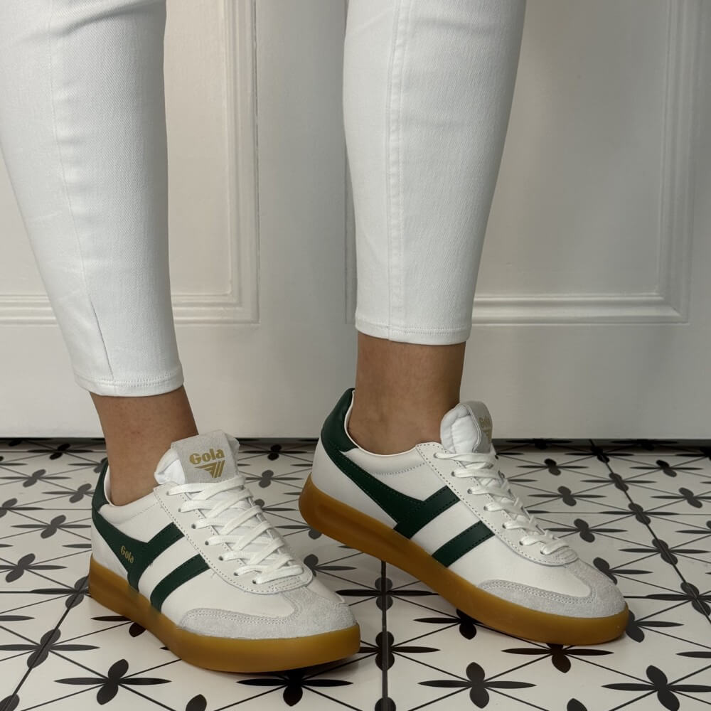 Gola White and Green Gum Sole Sneaker worn with white jeans