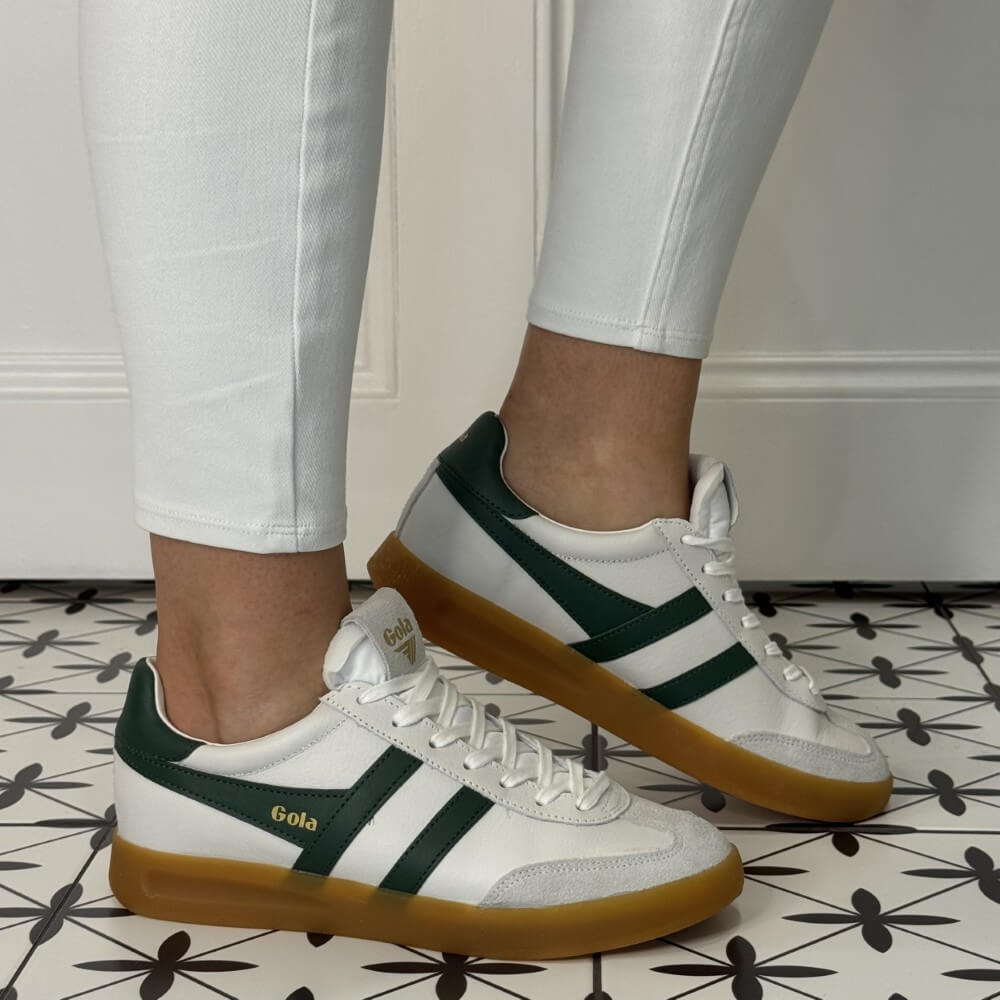 Gola White and Green Gum Sole Sneaker worn with white jeans