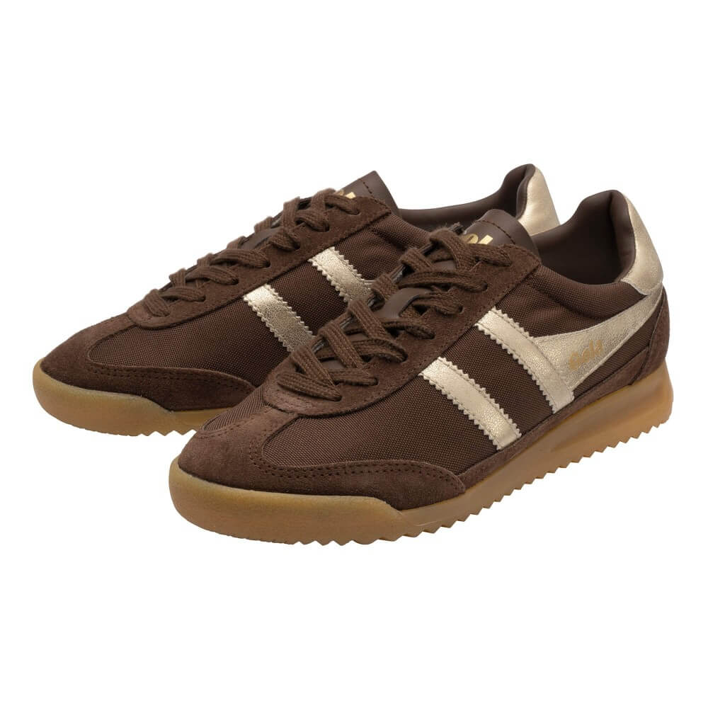 A pair of Gola retro-style low-top sneakers in dark brown suede and mesh, featuring three metallic gold stripes on the side, brown laces, and a gum-coloured sole.