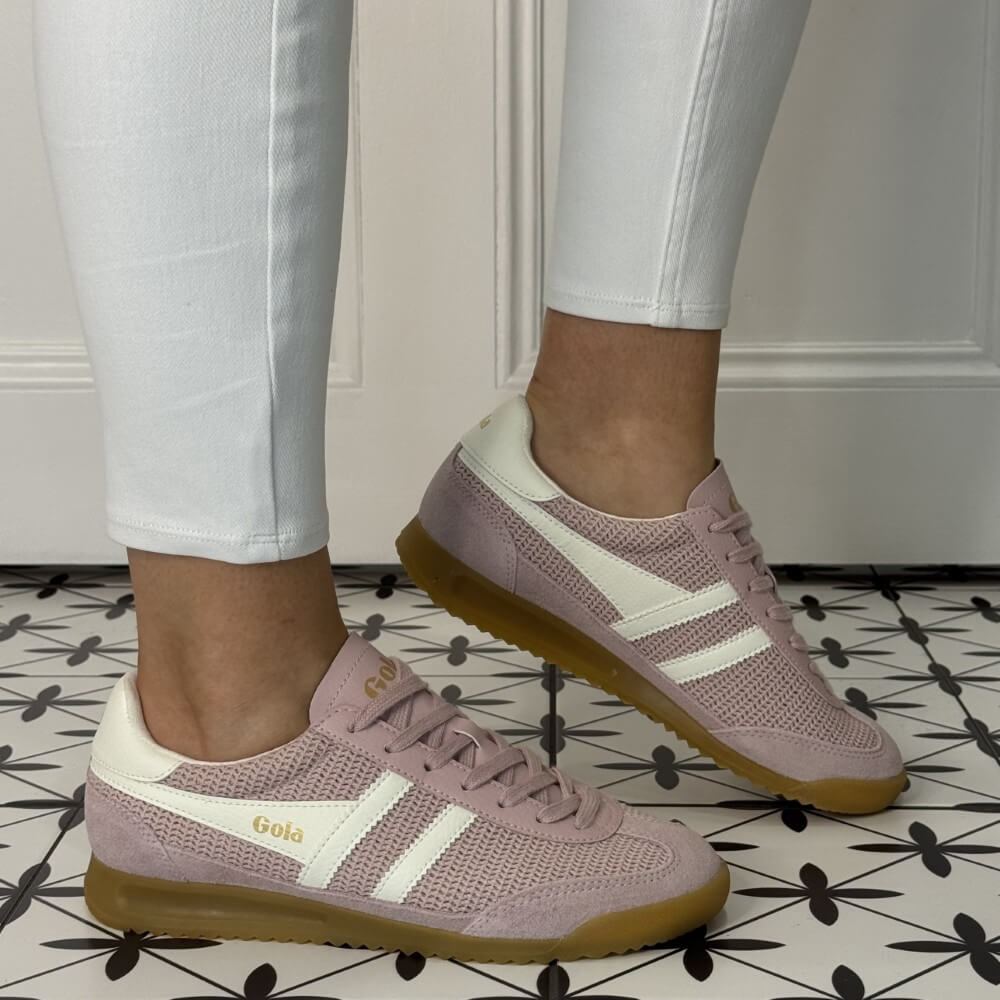 Gola Pink sneakers with white accents worn indoors on a patterned floor. Tornado Zephyr