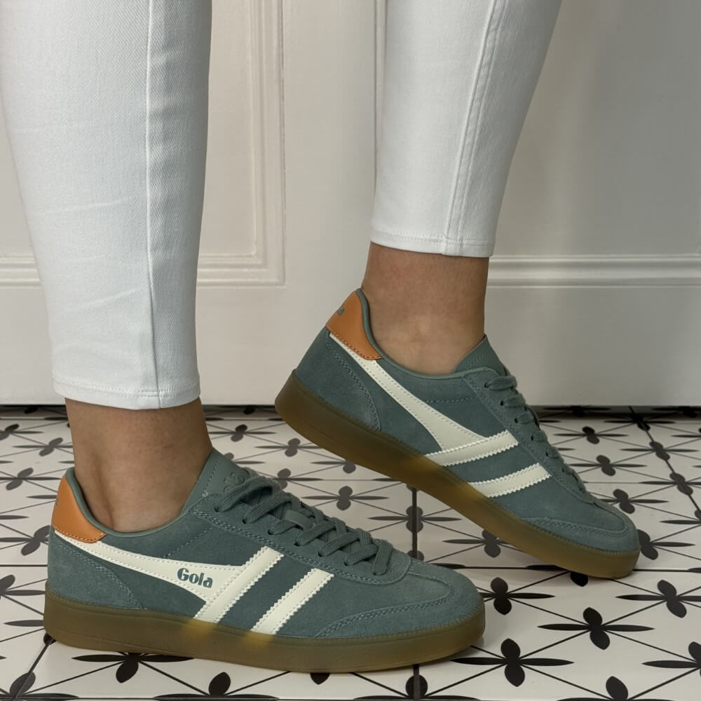 Gola viper Green and white gum sole sneakers worn with white jeans 