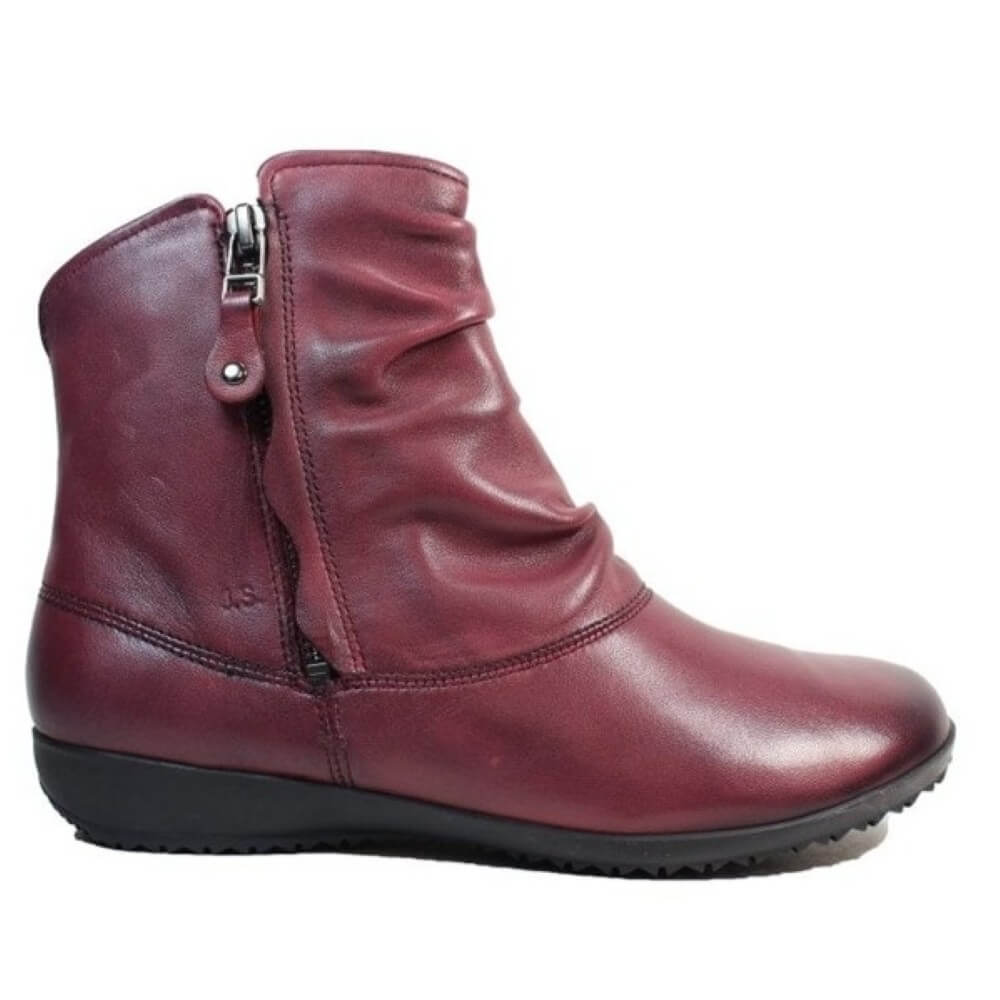 Maroon ankle boot with a zipper on a white background