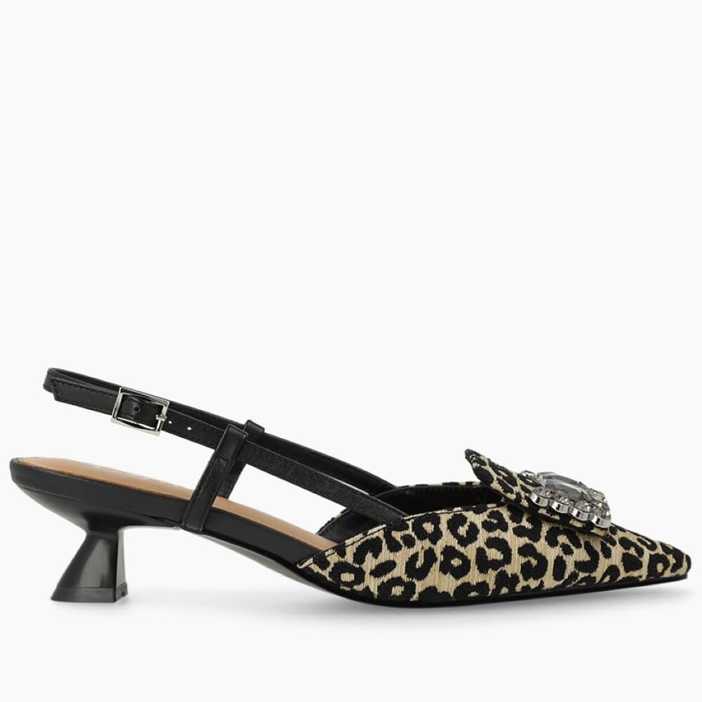 Lodi Leopard print shoe with a decorative brooch on a white background