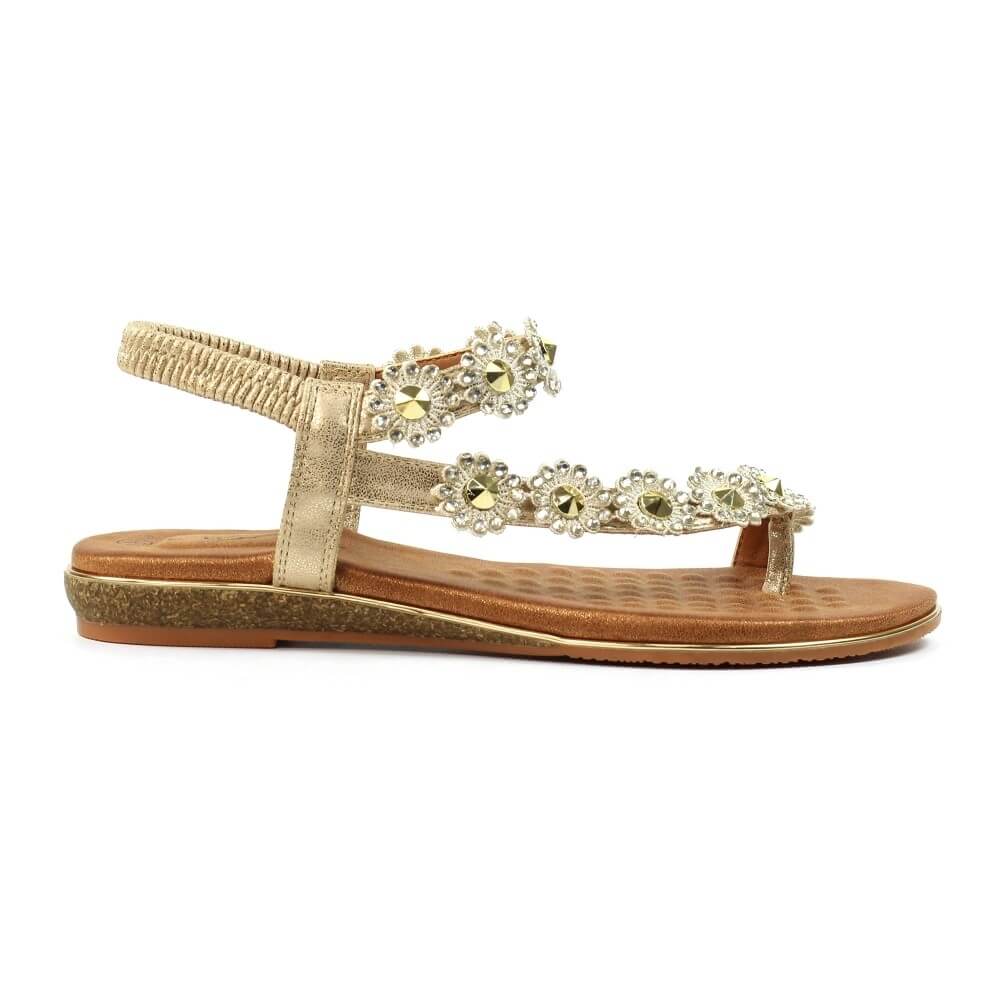 Lunar Charlotte Gold sandal with floral embellishments on a white background