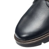 Video of a person's legs wearing black leather trousers and Ara dark navy blue leather lace-up boots with brown soles, set against a plain white background.