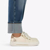 Video of person wearing Clarks Cream trainers