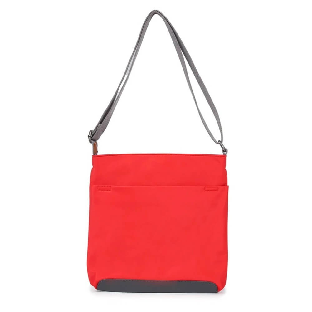 Red crossbody bag with a grey strap on a white background Roka